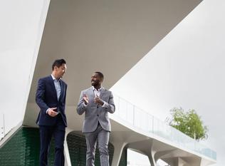 White collar workers meeting outdoors in a city