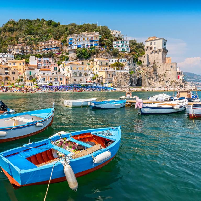 Leisure boats and traditional buildings in Cetara harbor, Amalfi coast, Italy.