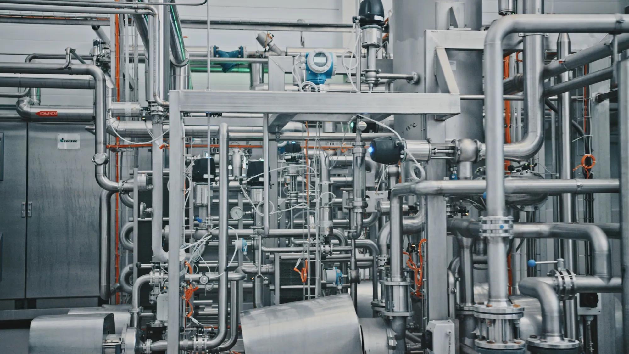 Shiny metal pipes, valves, and gauges intertwining within an industrial plant, showcasing the intricate network of a modern production facility; Shutterstock ID 2649690493; purchase_order: 994005; job: EMEA + India (Europe MiddleEast Africa); client: Gallagher; other: Marcom: Stock Assets